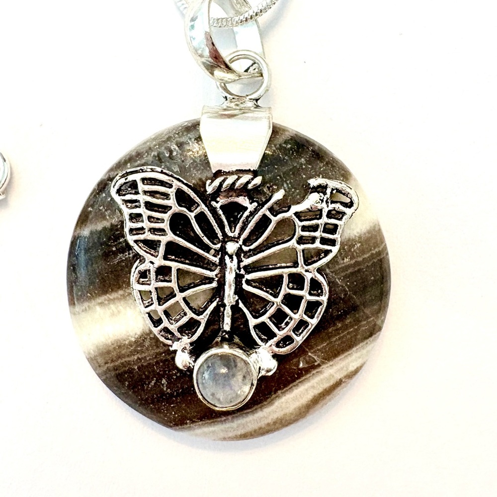 1 1/2 inch, Butterly, Zebra Calcite, Rainbow Moonstone pendant on silver chain.